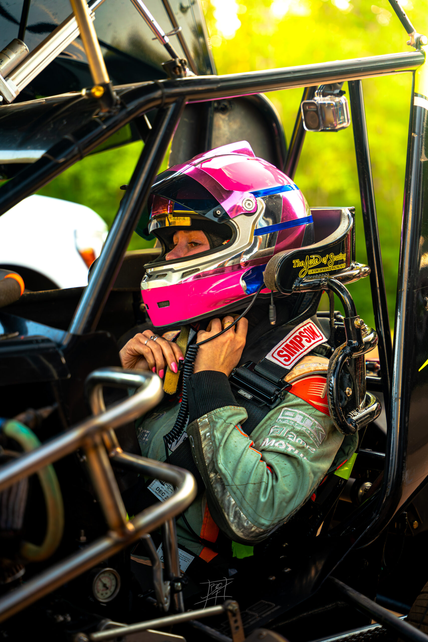 Sally Mott in her helmet getting ready to go dirt racing.